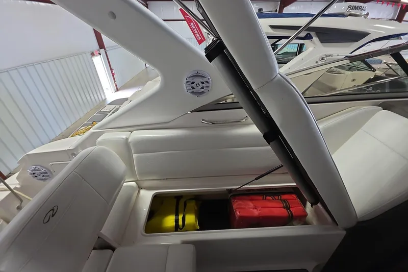 Slide: The Image of 2007 Regal 2860 Window Express boat interior with storage compartment open. - 9