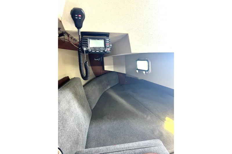 Slide: The Image of Interior of 1987 Catalina 30 Mk II sailboat with radio equipment and seating area. - 10