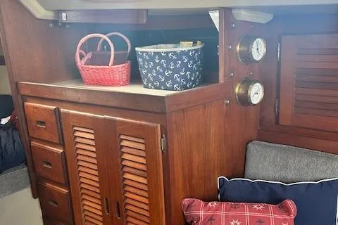 Slide: The Image of Interior of 1987 Catalina 30 Mk II sailboat with wooden cabinetry and nautical decor. - 15
