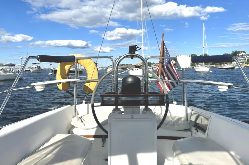 Slide: The Image of Cockpit view of 1987 Catalina 30 Mk II sailboat on a sunny day, with American flag. - 6