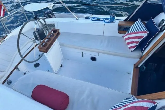 Slide: The Image of Cockpit of 1987 Catalina 30 Mk II sailboat with seating and nautical decor. - 8