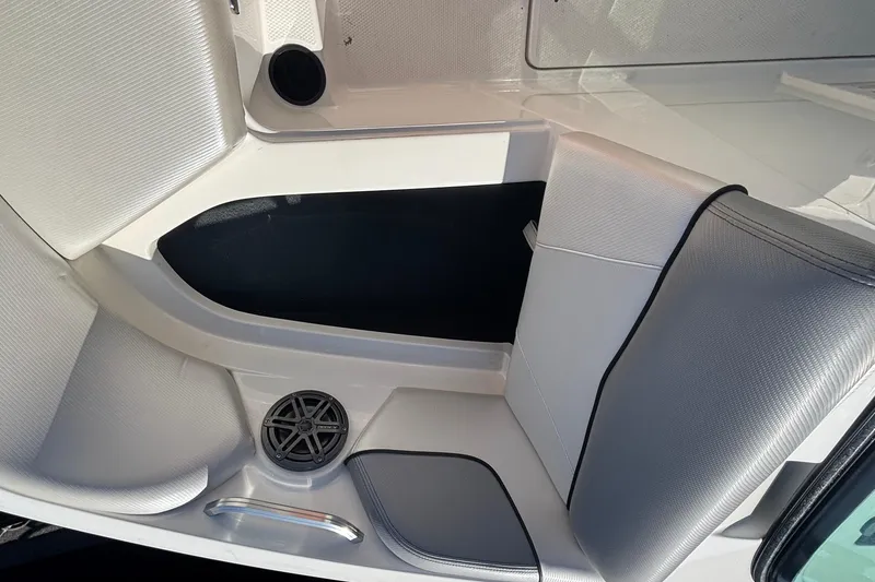 Slide: The Image of 2015 MasterCraft NXT20 boat interior with gray seating and speaker detail. - 20