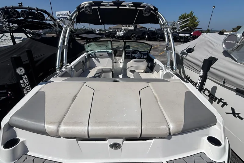 Slide: The Image of 2015 MasterCraft NXT20 boat interior with seating and wakeboard tower. - 4