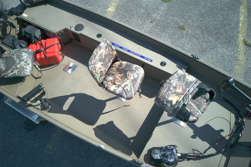 Slide: The Image of Boat interior with camouflage seats, red fuel tank, and motor, G3 15DK model, 2025. - 6