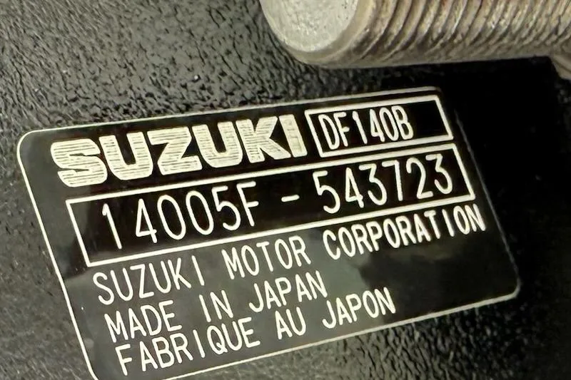 Slide: The Image of Suzuki DF140B engine plate, serial number 14005F-543723, made in Japan. - 12