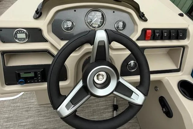 Slide: The Image of Steering console of 2026 Godfrey Xperience EX2286SBX boat with gauges and controls. - 9