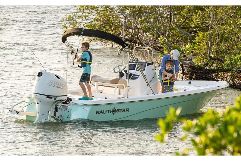 Slide: The Image of Manufacturer Provided Image: 2024 NauticStar 194 Bay boat with family fishing in shallow waters. - 2