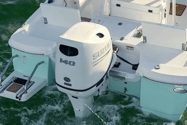 Slide: The Image of Manufacturer Provided Image: 2024 NauticStar 194 Bay boat with Suzuki 140 outboard motor in water. - 10