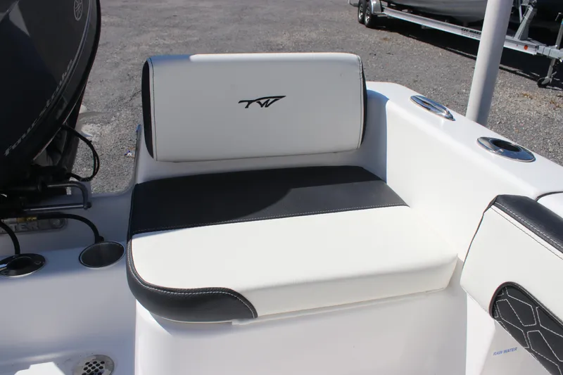 Slide: The Image of 2026 Tidewater 180 CC Adventure boat seat with black and white upholstery. - 13
