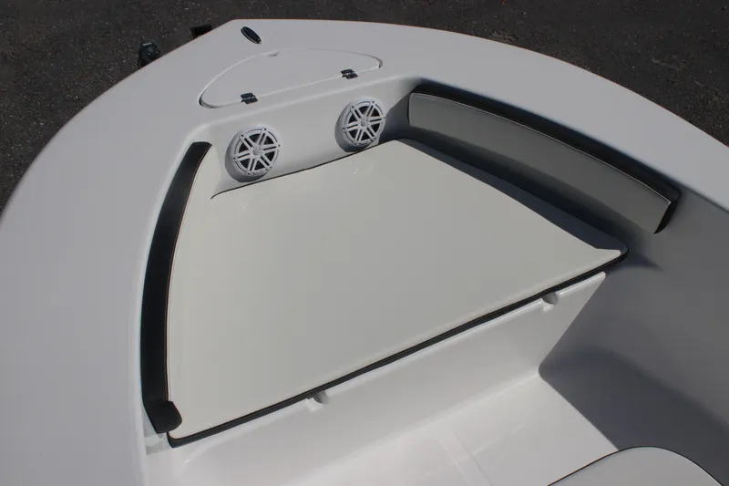 Slide: The Image of 2026 Tidewater 180 CC Adventure boat interior with cushioned seating and speakers. - 6