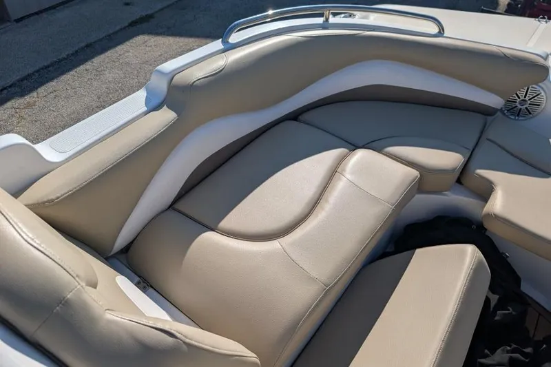Slide: The Image of 2017 Hurricane SunDeck Sport 201 IO boat interior with beige cushioned seating. - 8