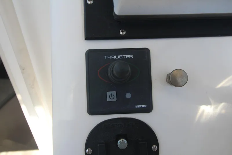 Slide: The Image of Control panel of a 2001 Mako 293 Walk Around boat featuring a Vetus thruster. - 25