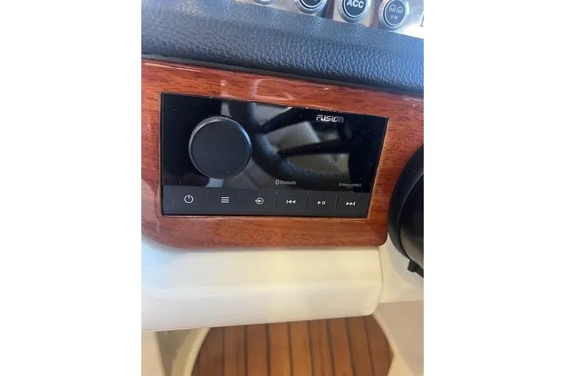 Slide: The Image of 2024 Chris-Craft Launch 27 dashboard with Fusion audio system and Bluetooth connectivity. - 18