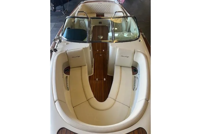 Slide: The Image of 2024 Chris-Craft Launch 27 boat interior with elegant seating and wooden flooring. - 22