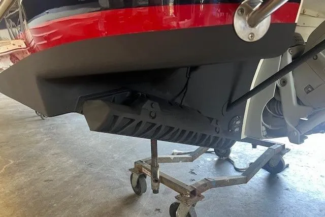 Slide: The Image of 2024 Chris-Craft Launch 27 boat on a wheeled stand, showcasing the hull and propeller area. - 7