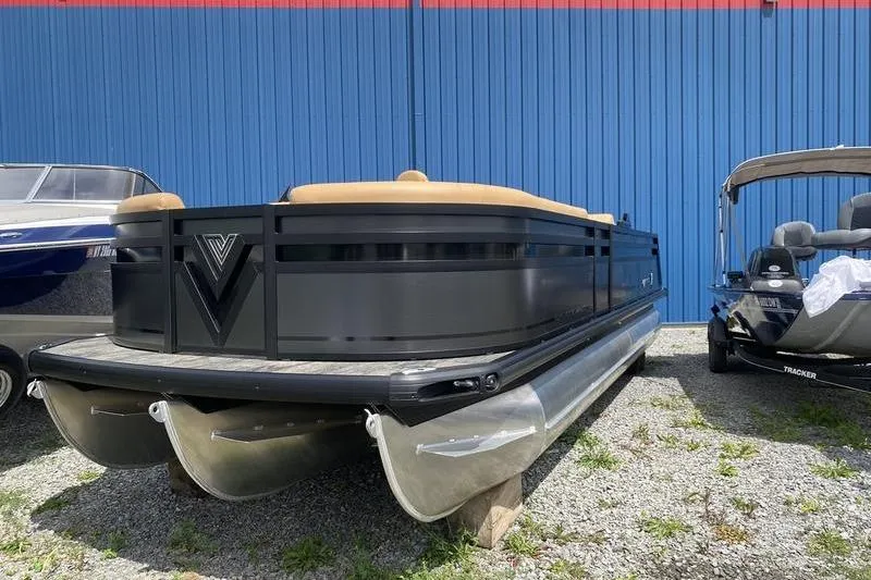 Slide: The Image of 2025 Viaggio Lago Z-S pontoon boat parked outdoors, blue building background. - 1