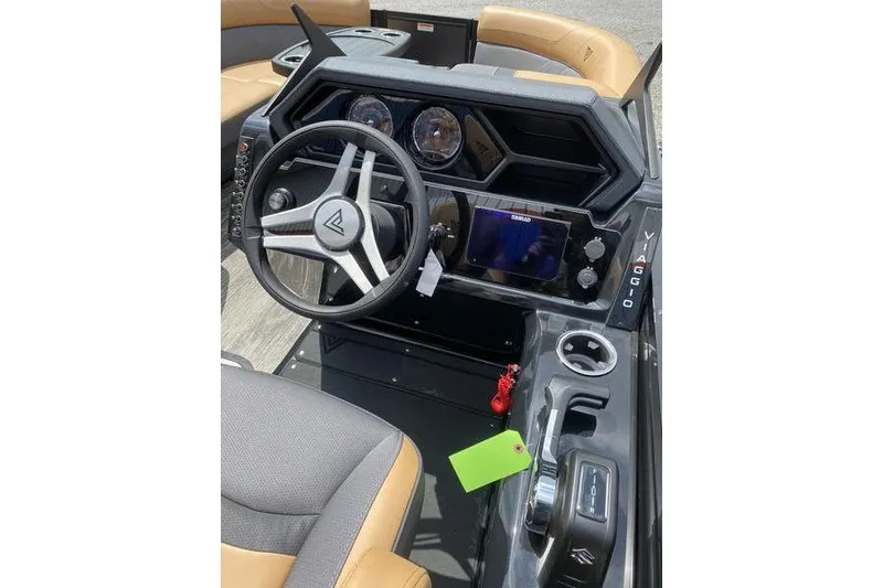 Slide: The Image of Viaggio Lago Z-S 2025 boat dashboard with steering wheel and control panel. - 10