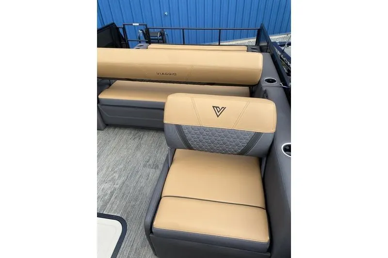 Slide: The Image of 2025 Viaggio Lago Z-S boat interior with tan and gray seating, blue background. - 26