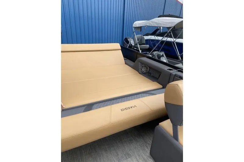 Slide: The Image of 2025 Viaggio Lago Z-S boat interior with tan seating and blue exterior. - 29