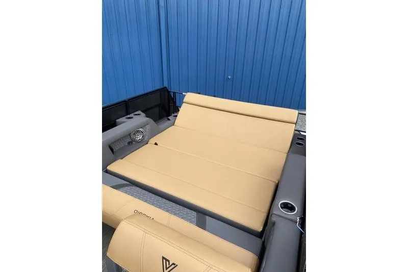 Slide: The Image of 2025 Viaggio Lago Z-S boat interior with tan seating and blue backdrop. - 9