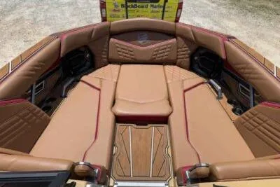 Slide: The Image of 2024 Tigé Ultré 25ZX boat interior with luxurious tan seating and stylish design. - 9