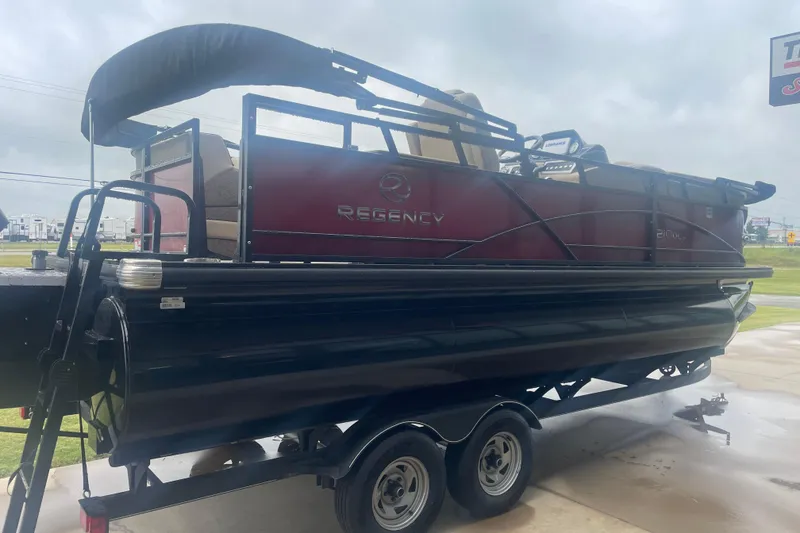 Slide: The Image of 2019 Regency 210 DL3 pontoon boat on trailer, side view. - 1