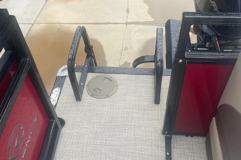 Slide: The Image of 2019 Regency 210 DL3 boat deck with wet flooring and railing. - 14