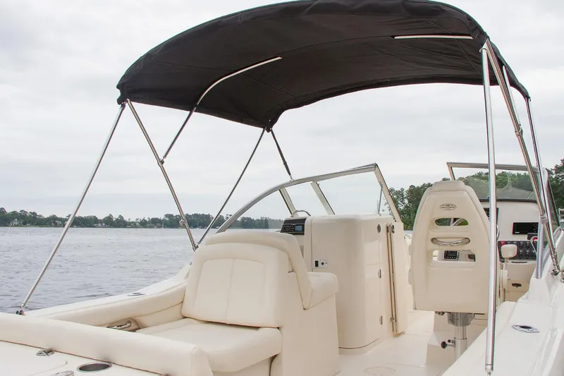 Slide: The Image of 2023 Grady-White Freedom 235 boat interior with open storage compartments and seating. - 10
