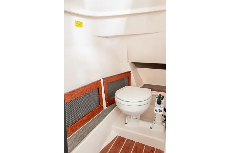 Slide: The Image of 2023 Grady-White Freedom 235 boat interior with luxurious seating and modern helm. - 15