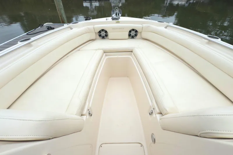 Slide: The Image of 2023 Grady-White Freedom 235 boat interior with cream seating and cup holders. - 27