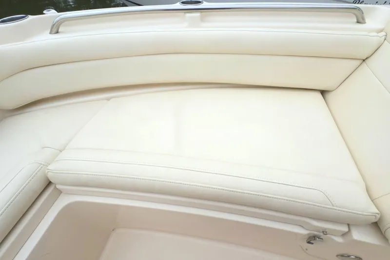 Slide: The Image of 2023 Grady-White Freedom 235 boat with cream-colored cushioned seating. - 28