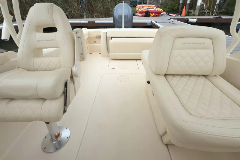 Slide: The Image of 2023 Grady-White Freedom 235 boat interior with luxurious beige seating and modern design. - 34