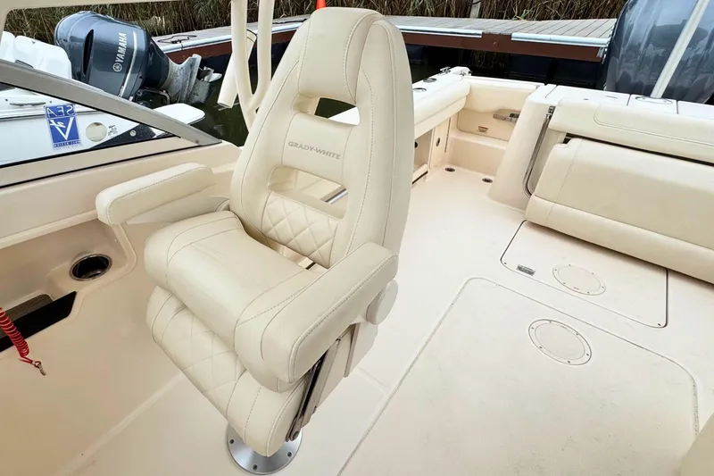 Slide: The Image of 2023 Grady-White Freedom 235 boat interior with luxurious seating and Yamaha engine. - 36