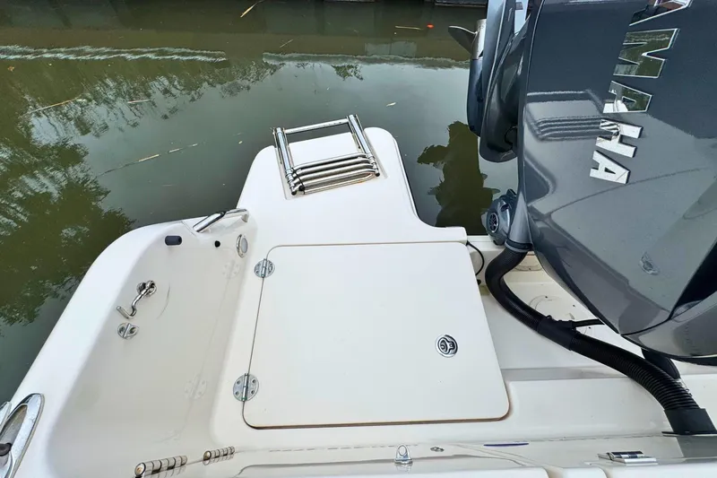 Slide: The Image of 2023 Grady-White Freedom 235 boat stern with Yamaha engine and swim platform. - 40