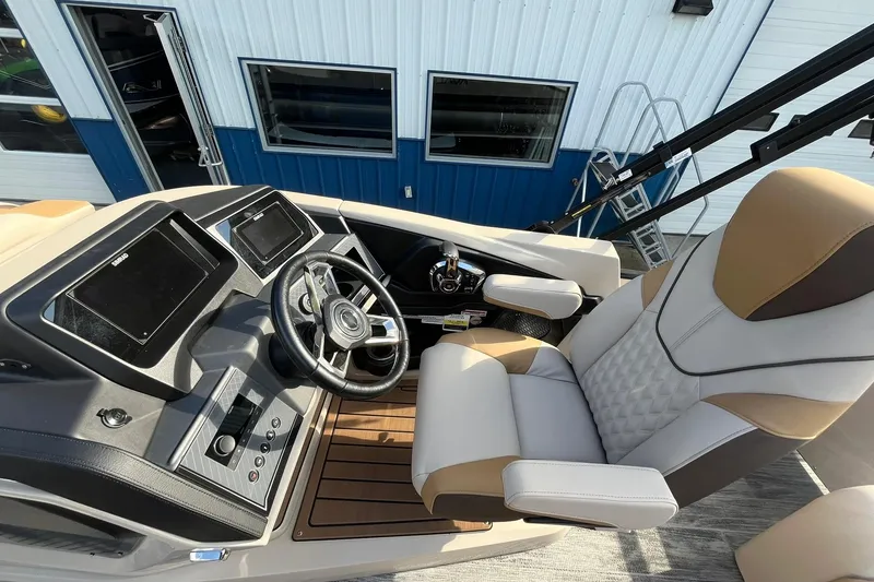 Slide: The Image of 2026 Avalon Catalina Versatile Rear Bench boat cockpit with modern steering and controls. - 14