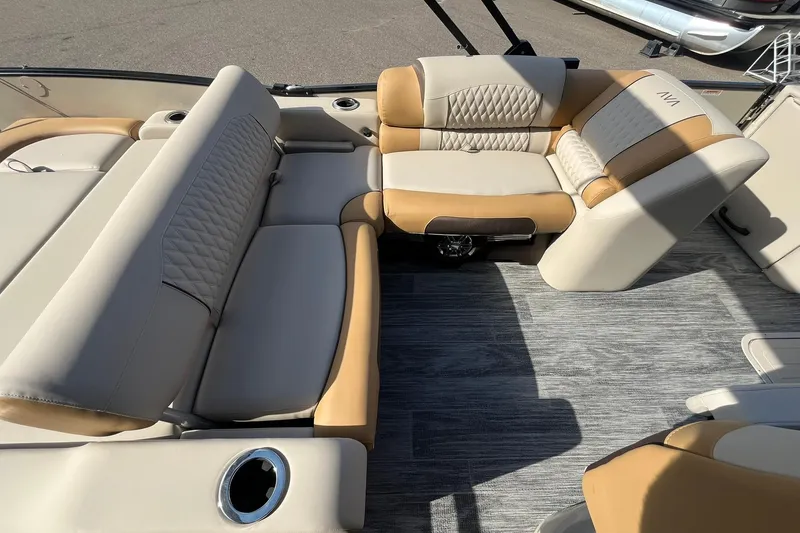 Slide: The Image of 2026 Avalon Catalina Versatile Rear Bench with luxurious beige and tan seating on a boat. - 18