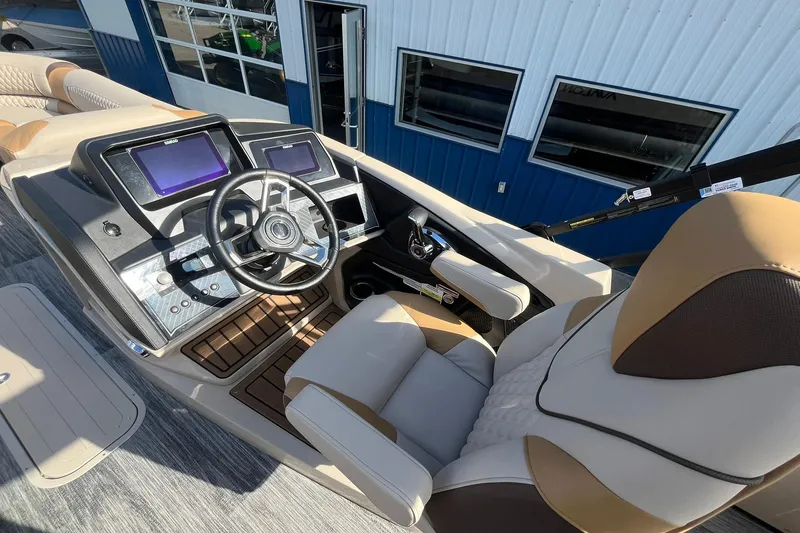 Slide: The Image of 2026 Avalon Catalina Versatile Rear Bench boat cockpit with modern controls and plush seating. - 19