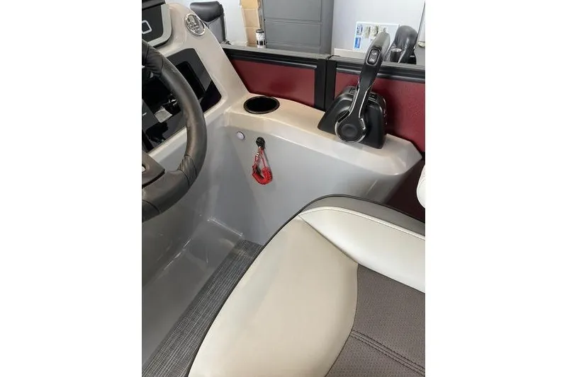 Slide: The Image of Interior of 2025 Viaggio Lago V-U boat, featuring steering wheel and control panel. - 12