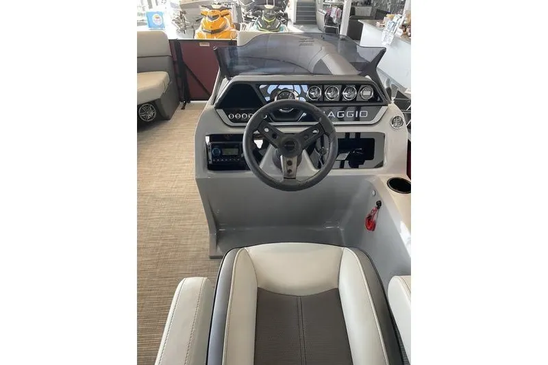 Slide: The Image of 2025 Viaggio Lago V-U boat dashboard with steering wheel and modern controls. - 9