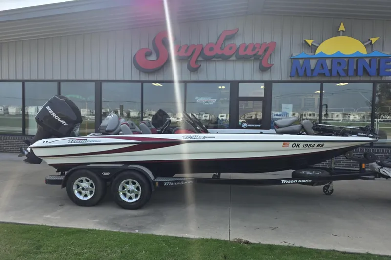 The Image of 2006 Triton Tr-21X HP DC boat on trailer outside Sundown Marine dealership. - 0
