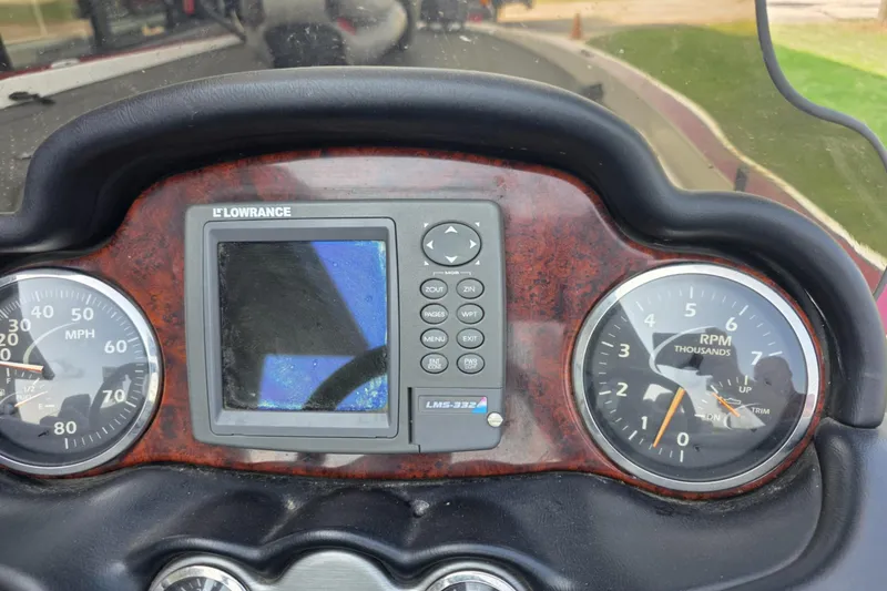 Slide: The Image of Dashboard of a 2006 Triton Tr-21X HP DC boat with Lowrance GPS and gauges. - 7