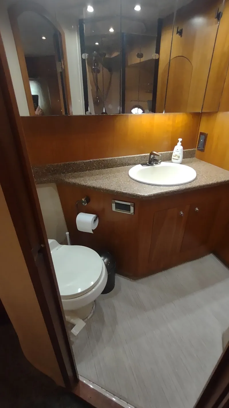 Slide: The Image of Bathroom interior of 2001 Cruisers Yachts 4450 Express Motoryacht with sink and toilet. - 34