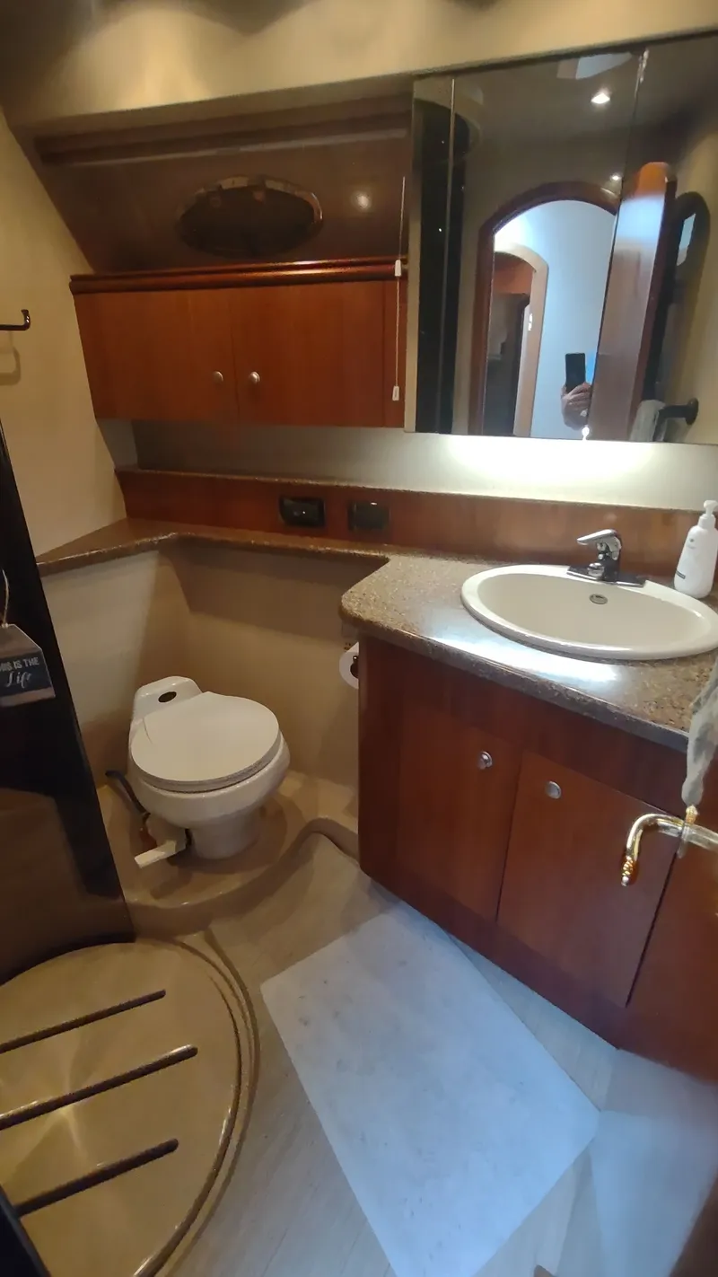 Slide: The Image of Luxurious bathroom in 2001 Cruisers Yachts 4450 Express Motoryacht with modern amenities. - 41