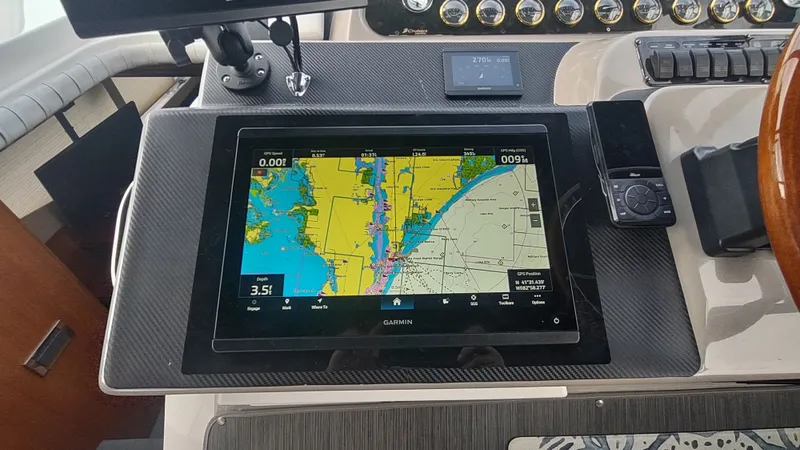 Slide: The Image of Garmin navigation system on 2001 Cruisers Yachts 4450 Express Motoryacht dashboard. - 16