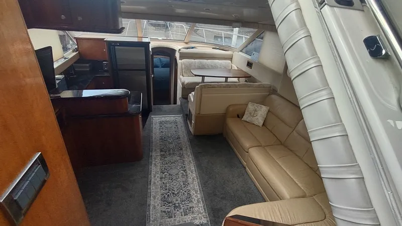Slide: The Image of Luxurious interior of 2001 Cruisers Yachts 4450 Express Motoryacht with leather seating and elegant decor. - 23