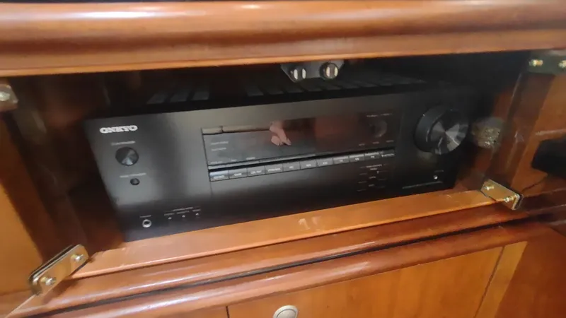 Slide: The Image of Onkyo audio receiver in wooden cabinet of 2001 Cruisers Yachts 4450 Express Motoryacht. - 28