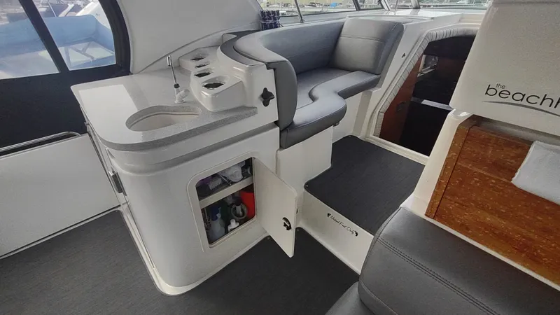 Slide: The Image of 2001 Cruisers Yachts 4450 Express Motoryacht interior with seating and storage. - 3