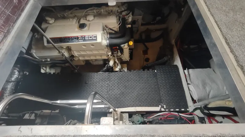 Slide: The Image of Engine compartment of 2001 Cruisers Yachts 4450 Express Motoryacht, showcasing detailed machinery. - 46