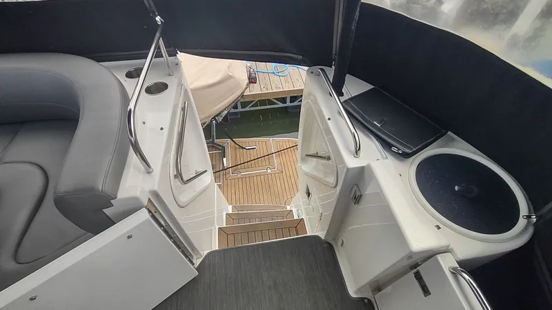 Slide: The Image of 2001 Cruisers Yachts 4450 Express Motoryacht interior with seating and steps to deck. - 7