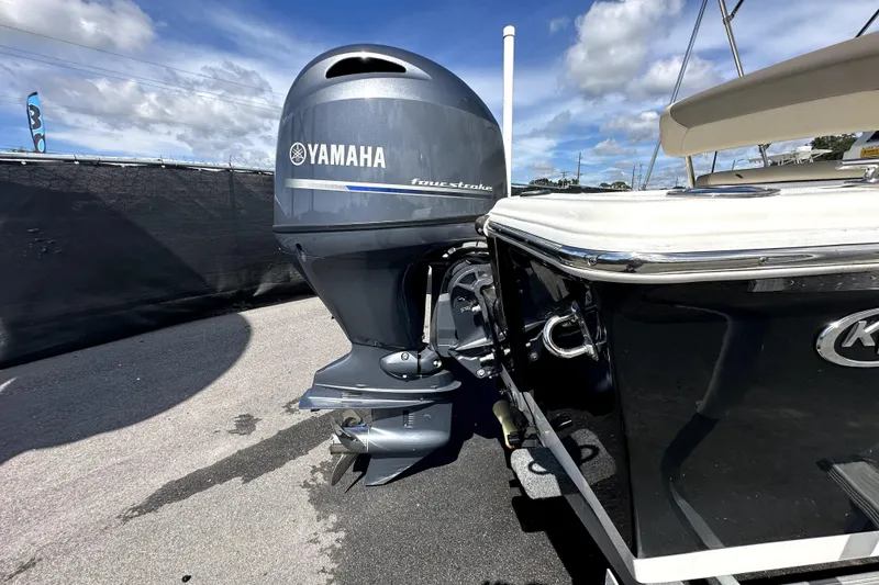 Slide: The Image of 2022 Key West 1720 Center Console boat on trailer under blue sky. - 10